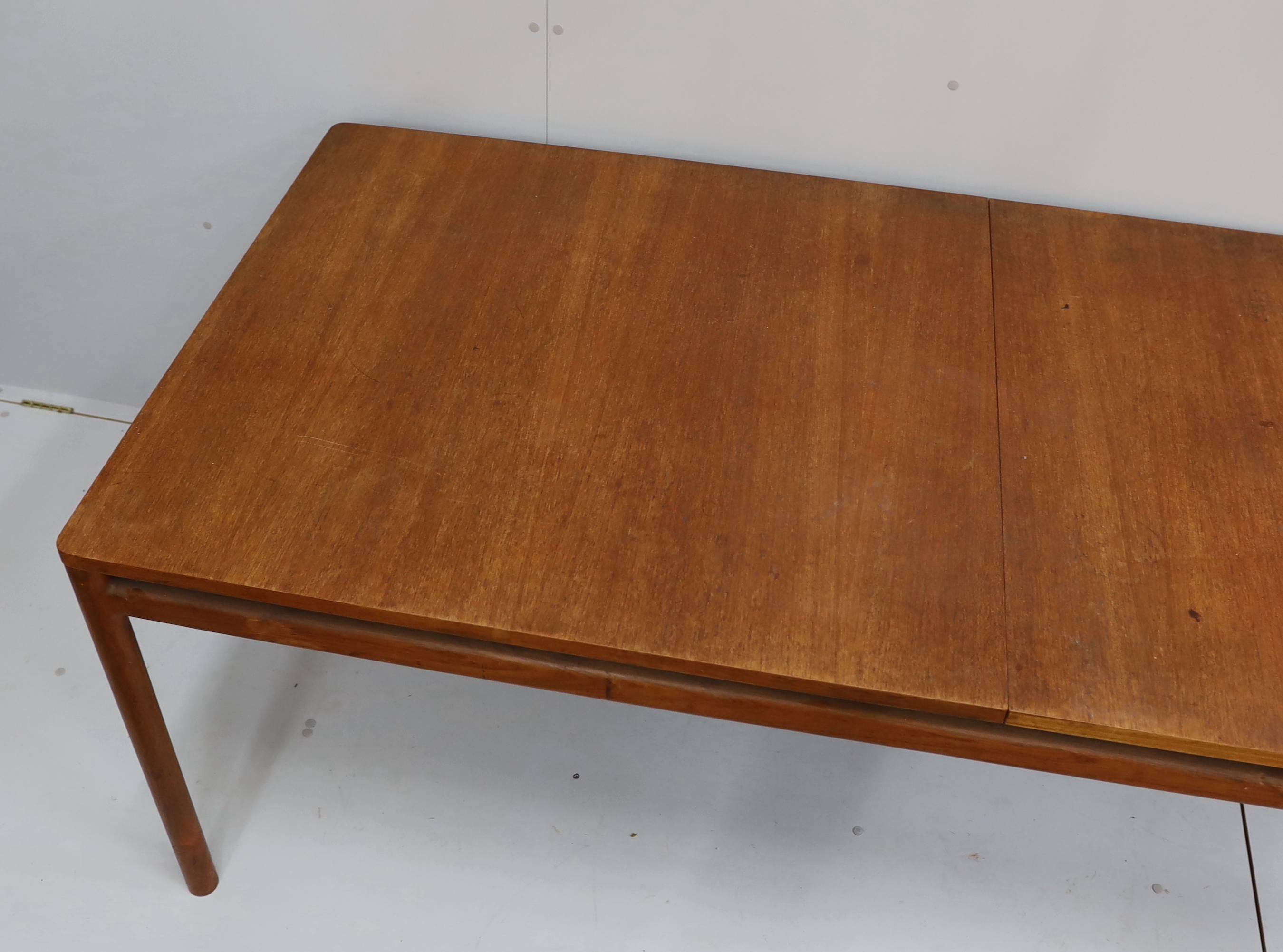 A mid century Danish design rectangular teak extending dining table, width 200cm, depth 92cm, height 73cm